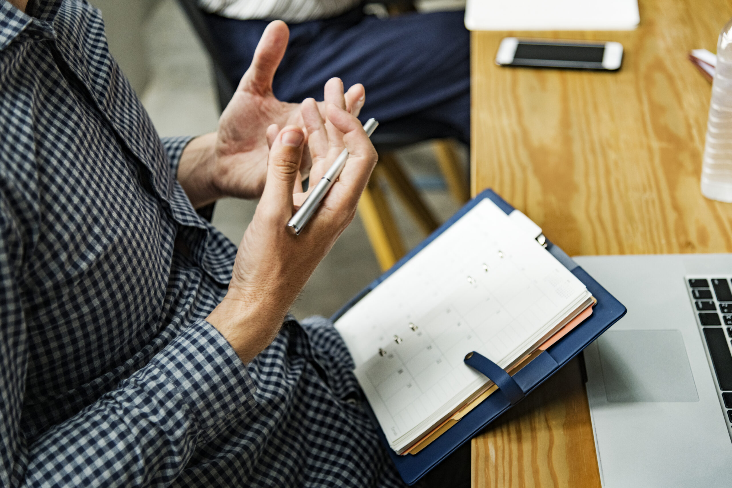Man reading from his agenda